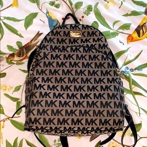 Michael Kors monogram back pack. With MK wallet